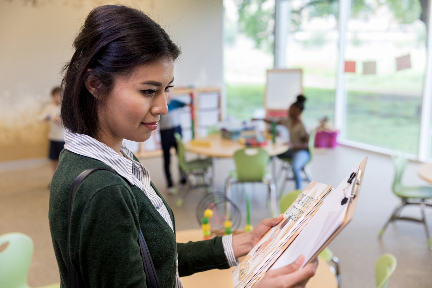 teacher-looking-at-lesson-plans
